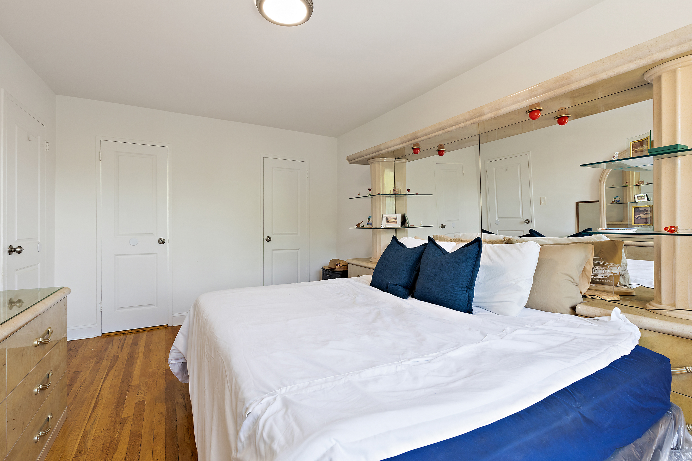 205 East 238th Street, Unit 2C Bronx, NY 10470 - Photo 12 of 14 a large bed sitting in a bedroom next to a window