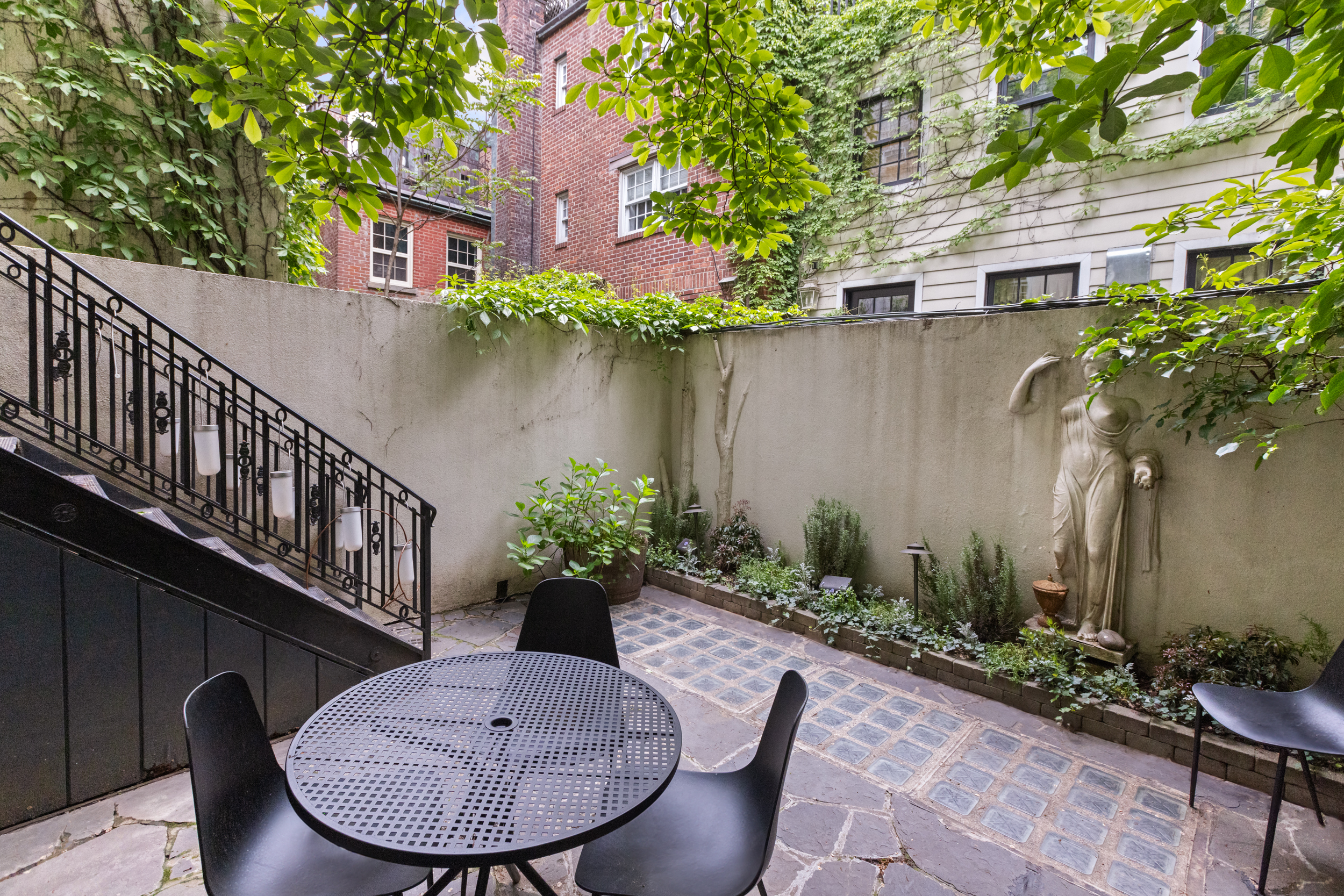 49 Barrow Street Manhattan, NY 10014 - Photo 12 of 25 a view of a balcony with furniture