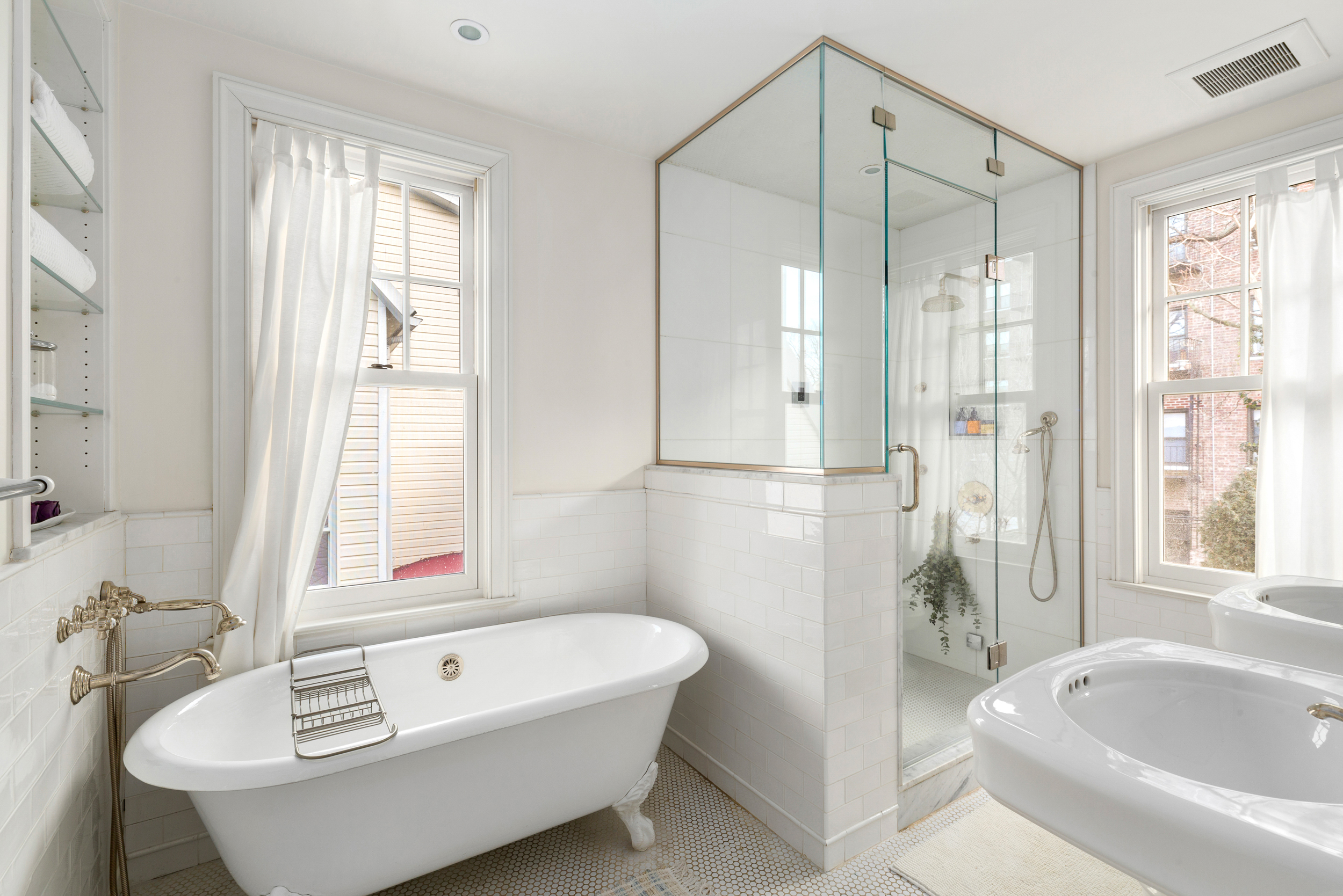 200 Fenimore Street Brooklyn, NY 11225 - Photo 15 of 24 a bathroom with a tub a sink and a window