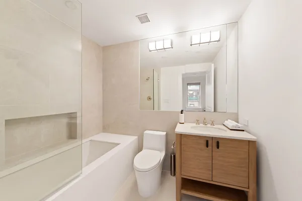 a bathroom with a sink a toilet and a bathtub