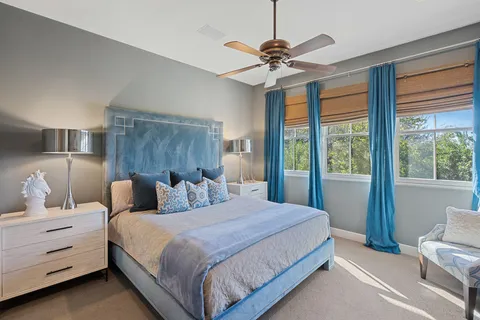 a view of a balcony with chairs and wooden floor