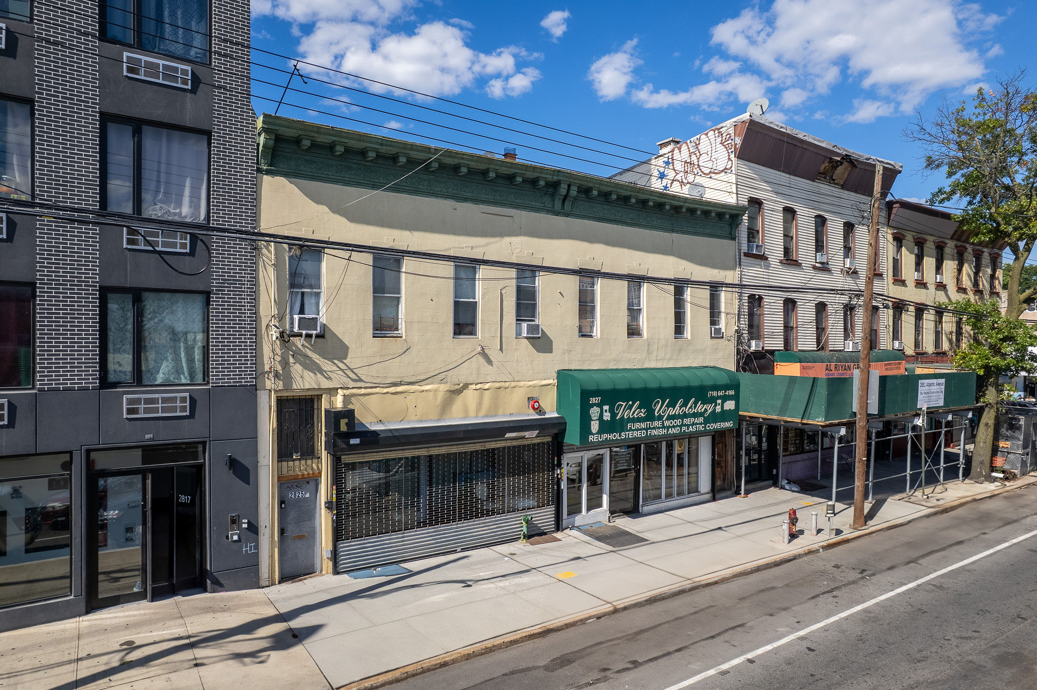 2825 Atlantic Avenue Brooklyn, NY 11207 - Photo 2 of 5 front view of a building with a glass door