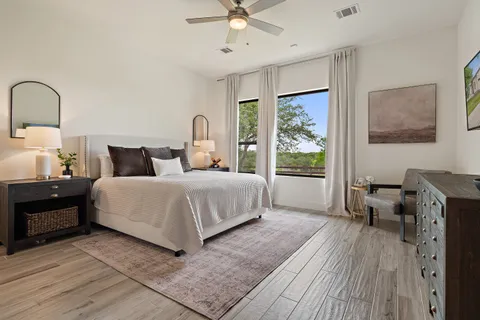 a bedroom with a large bed and a window