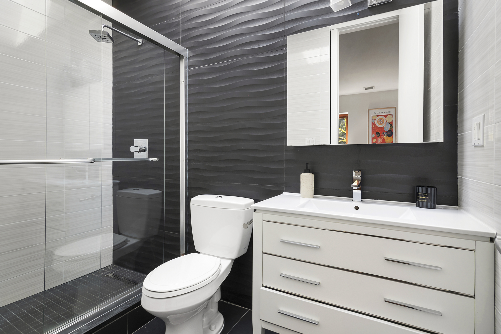 698 Halsey Street Brooklyn, NY 11233 - Photo 8 of 13 a bathroom with a toilet sink vanity and mirror