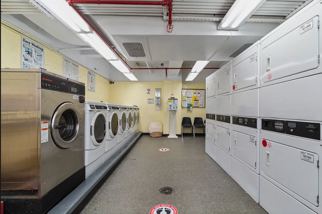 170 West 23rd Street, Unit 2F Manhattan, NY 10011 - Photo 6 of 10 a utility room with dryer and washer