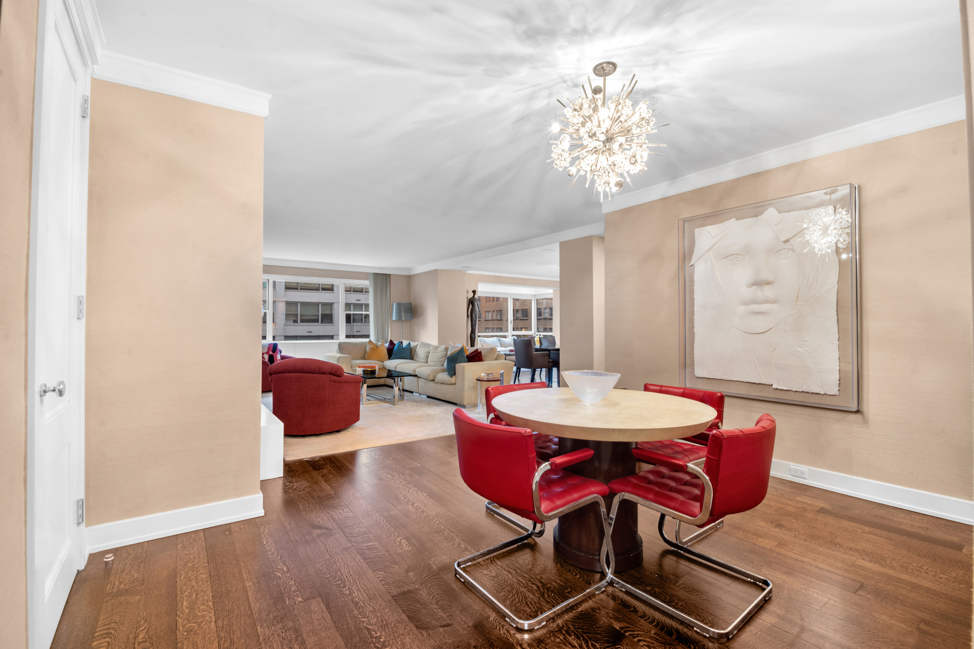 150 East 69th Street, Unit 6Q Manhattan, NY 10021 - Photo 9 of 15 a view of a dining room with furniture and wooden floor