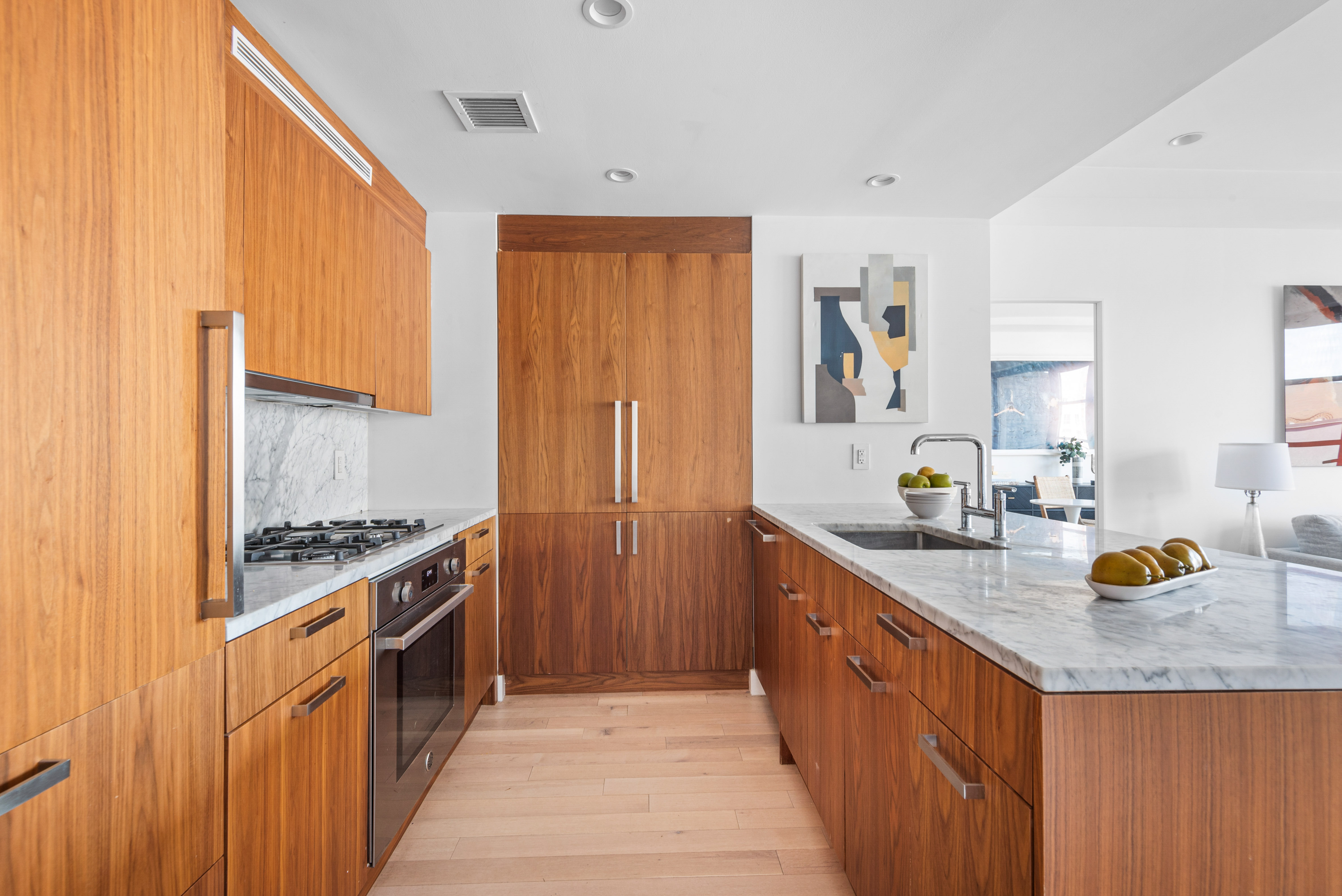 476 Union Avenue, Unit PH5A Brooklyn, NY 11211 - Photo 6 of 17 a kitchen with stainless steel appliances granite countertop a stove a sink and a refrigerator