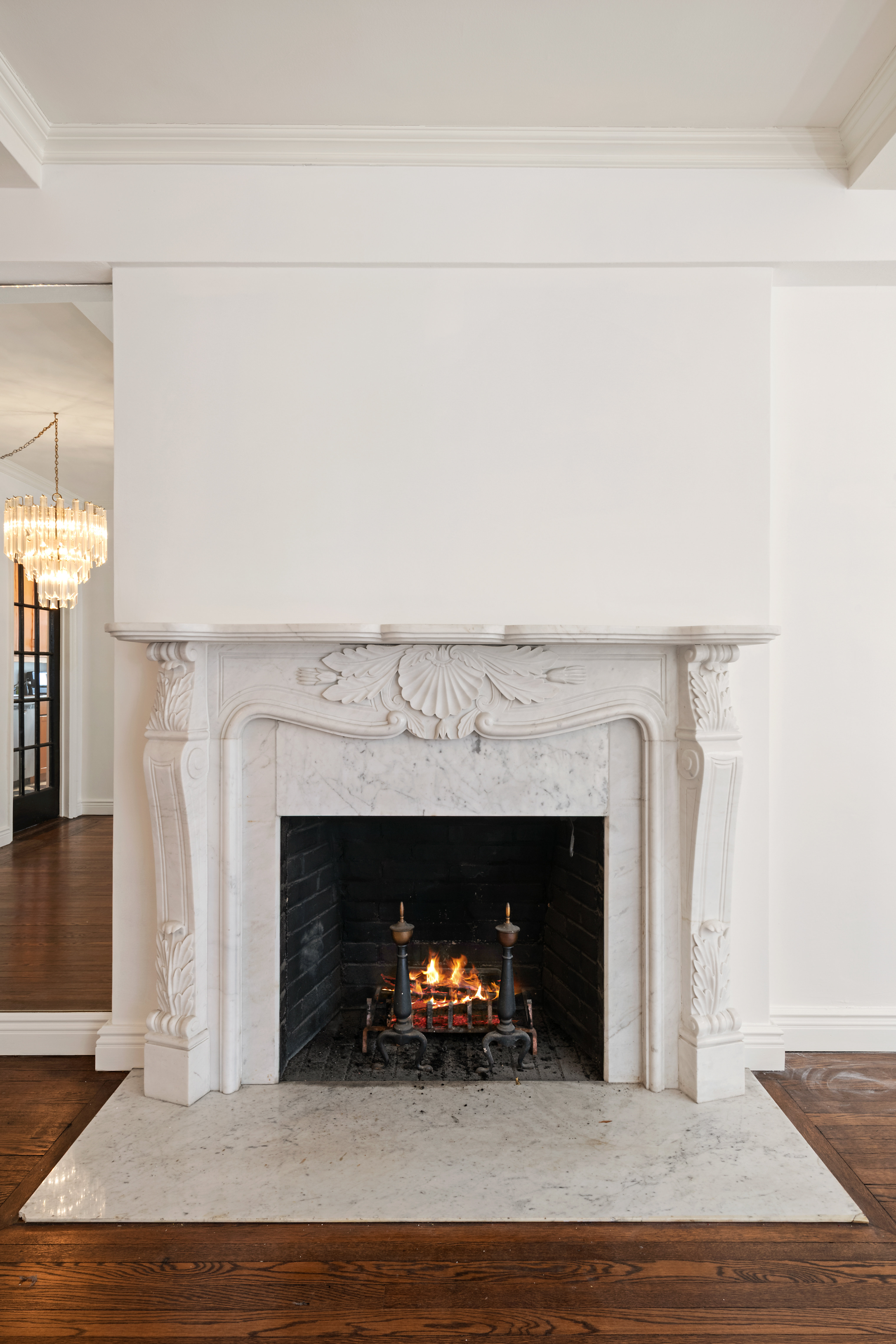210 East 73rd Street, Unit 9EF Manhattan, NY 10021 - Photo 5 of 16 a living room with a fireplace