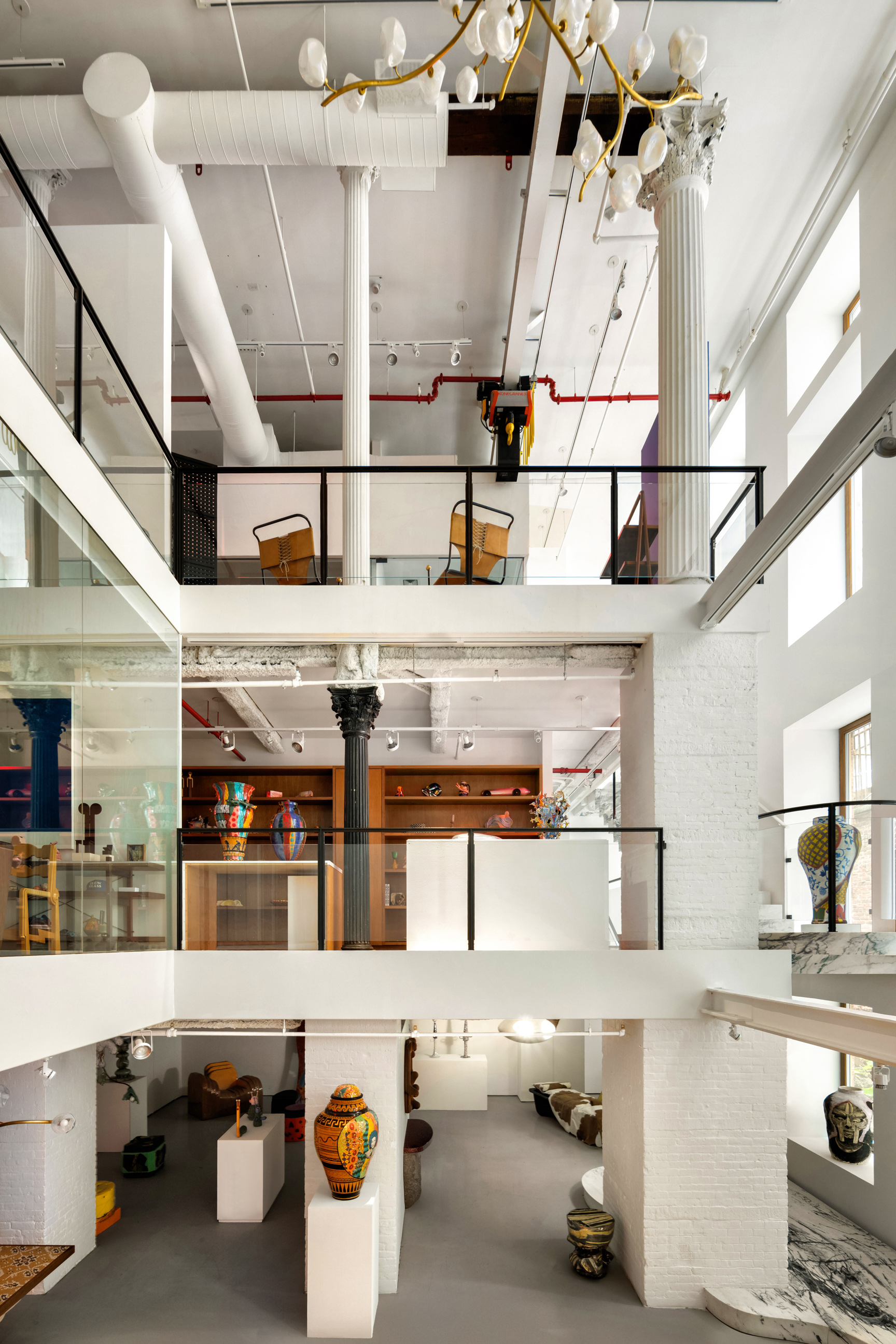 64 White Street, Unit RETAIL Manhattan, NY 10013 - Photo 16 of 21 a kitchen with stainless steel appliances granite countertop a sink and cabinets