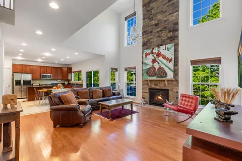 a living room with fireplace furniture and a fireplace