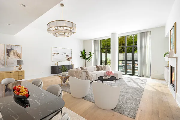 215 Sullivan Street, Unit THC Manhattan, NY 10012 - Photo 3 of 16 a living room with furniture and a large window