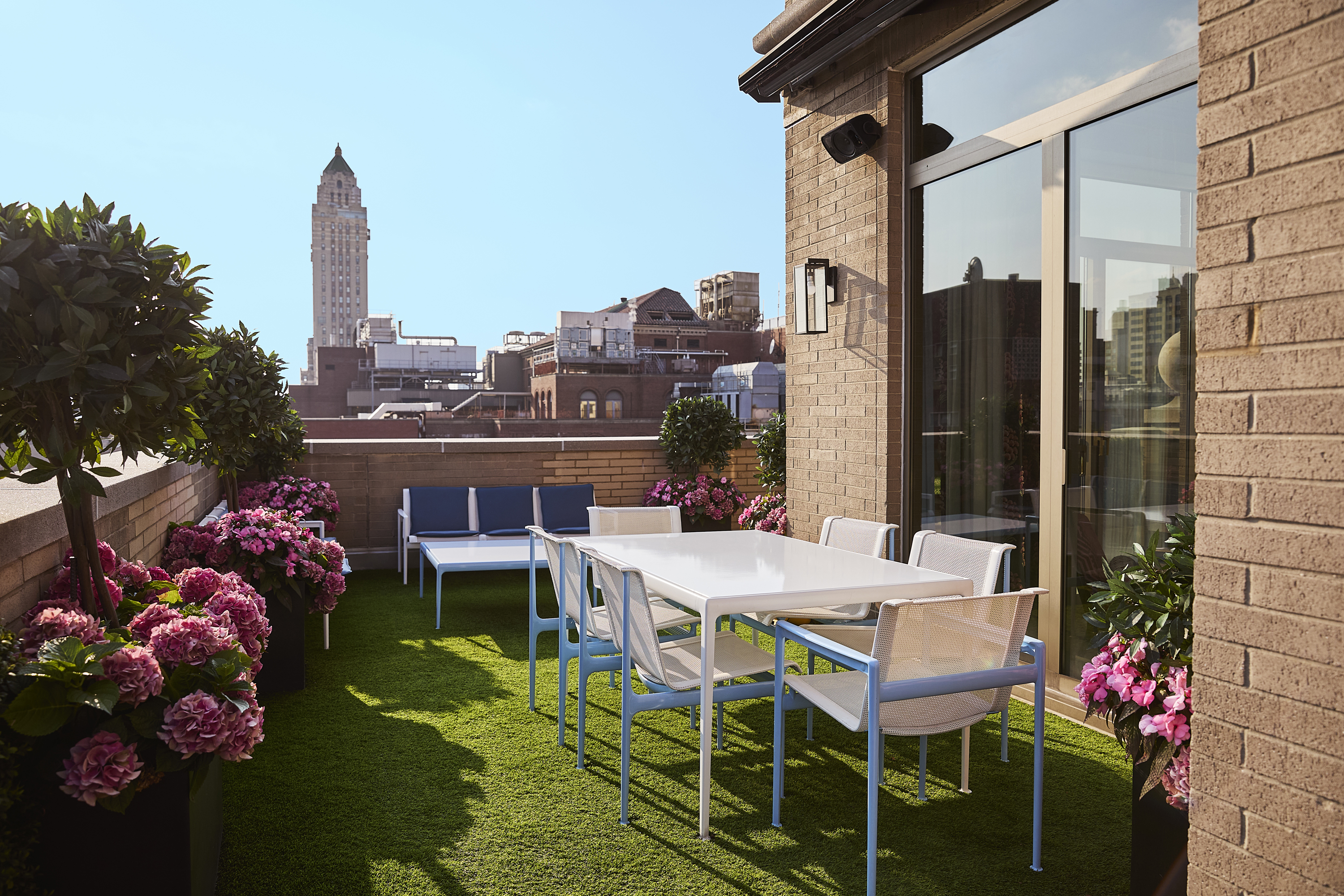 145 East 76th Street, Unit PH Manhattan, NY 10021 - Photo 9 of 25 a table and chairs in front of a door