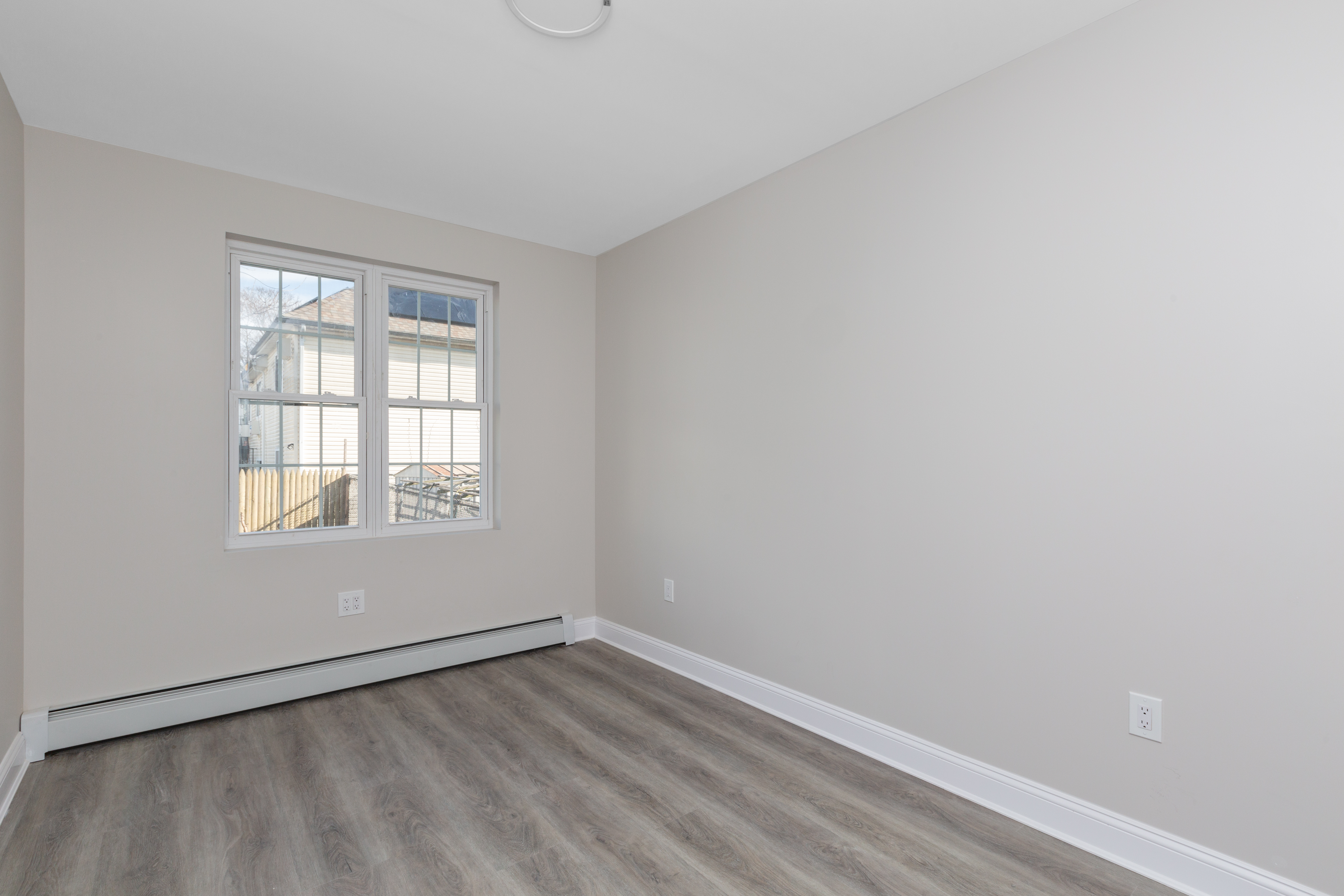 143-10 Shore Avenue Queens, NY 11435 - Photo 14 of 30 an empty room with a window