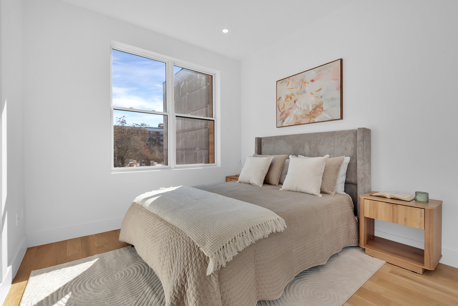 97 Seigel Street, Unit 2R Brooklyn, NY 11206 - Photo 3 of 7 a bedroom with a large bed and a window