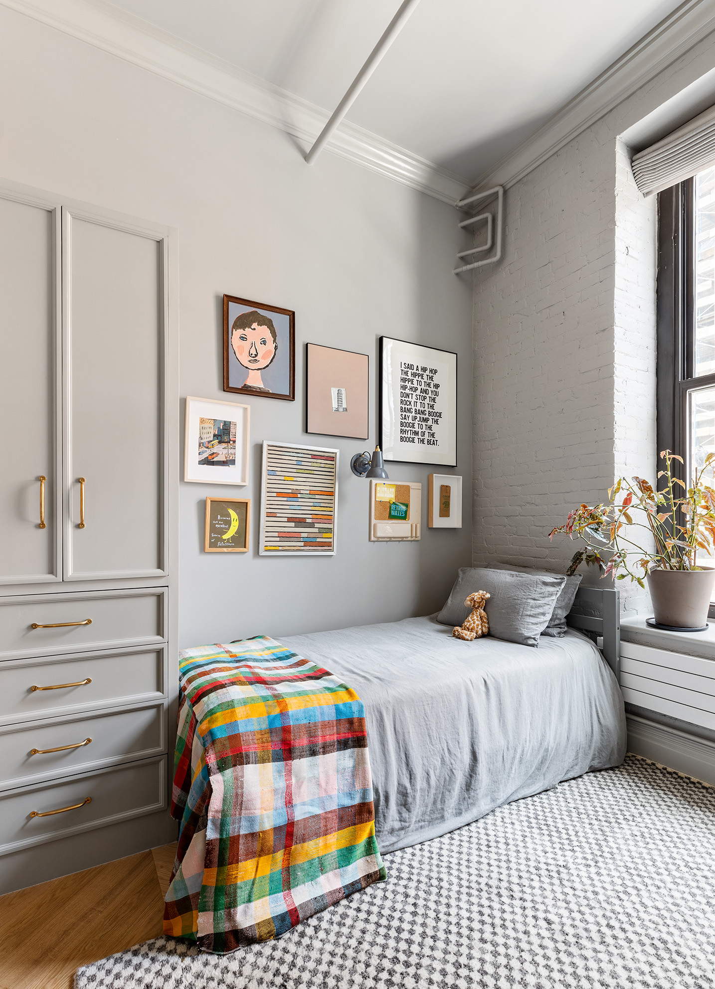 35 Mercer Street, Unit 3E Manhattan, NY 10013 - Photo 17 of 21 a bedroom with a bed and dresser