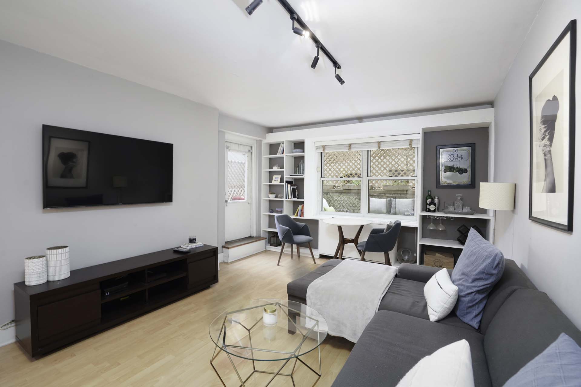 a living room with furniture and a flat screen tv