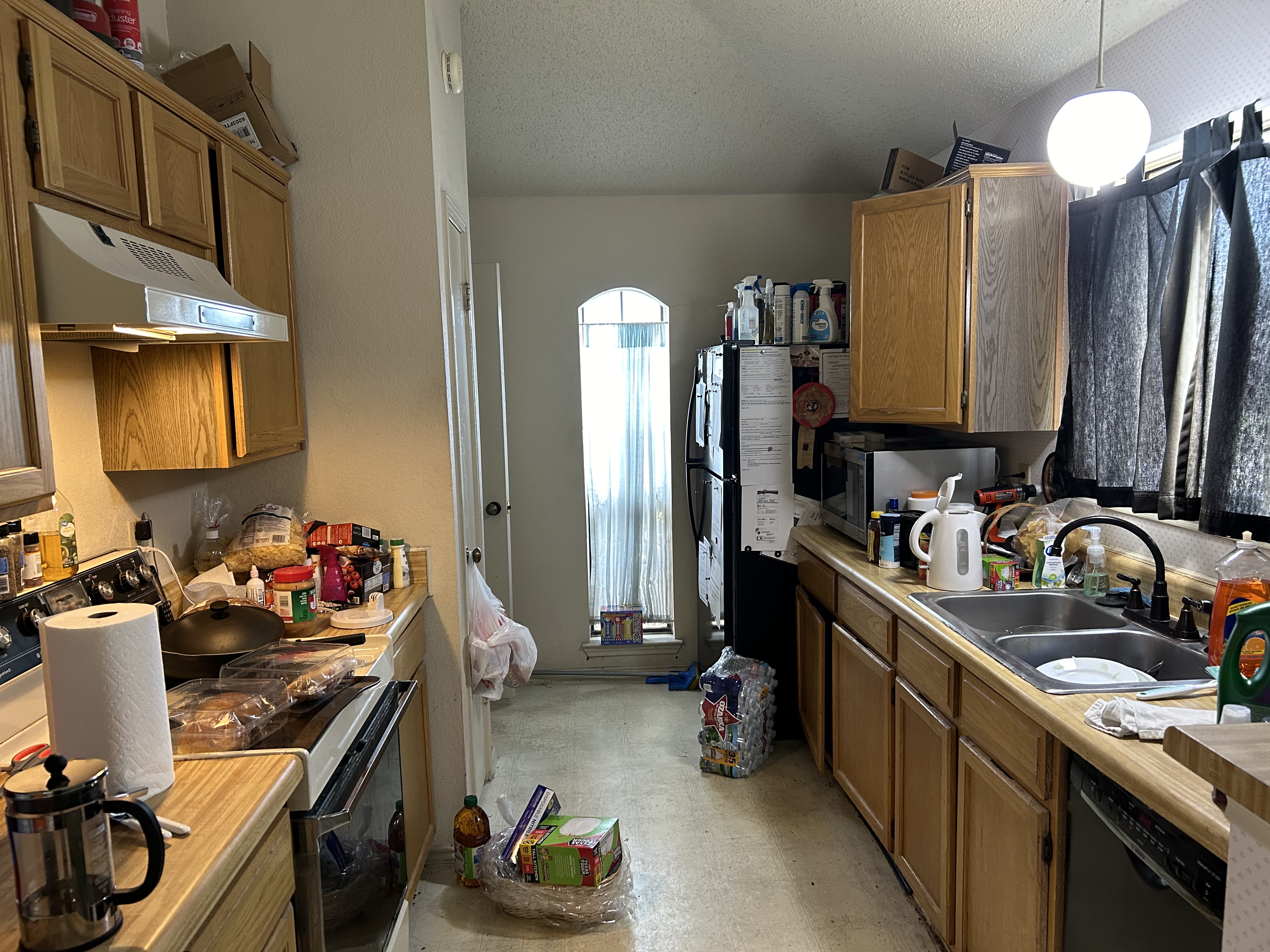 408 Rose Drive Allen, TX 75002 - Photo 5 of 11 a kitchen with a sink stove and cabinets