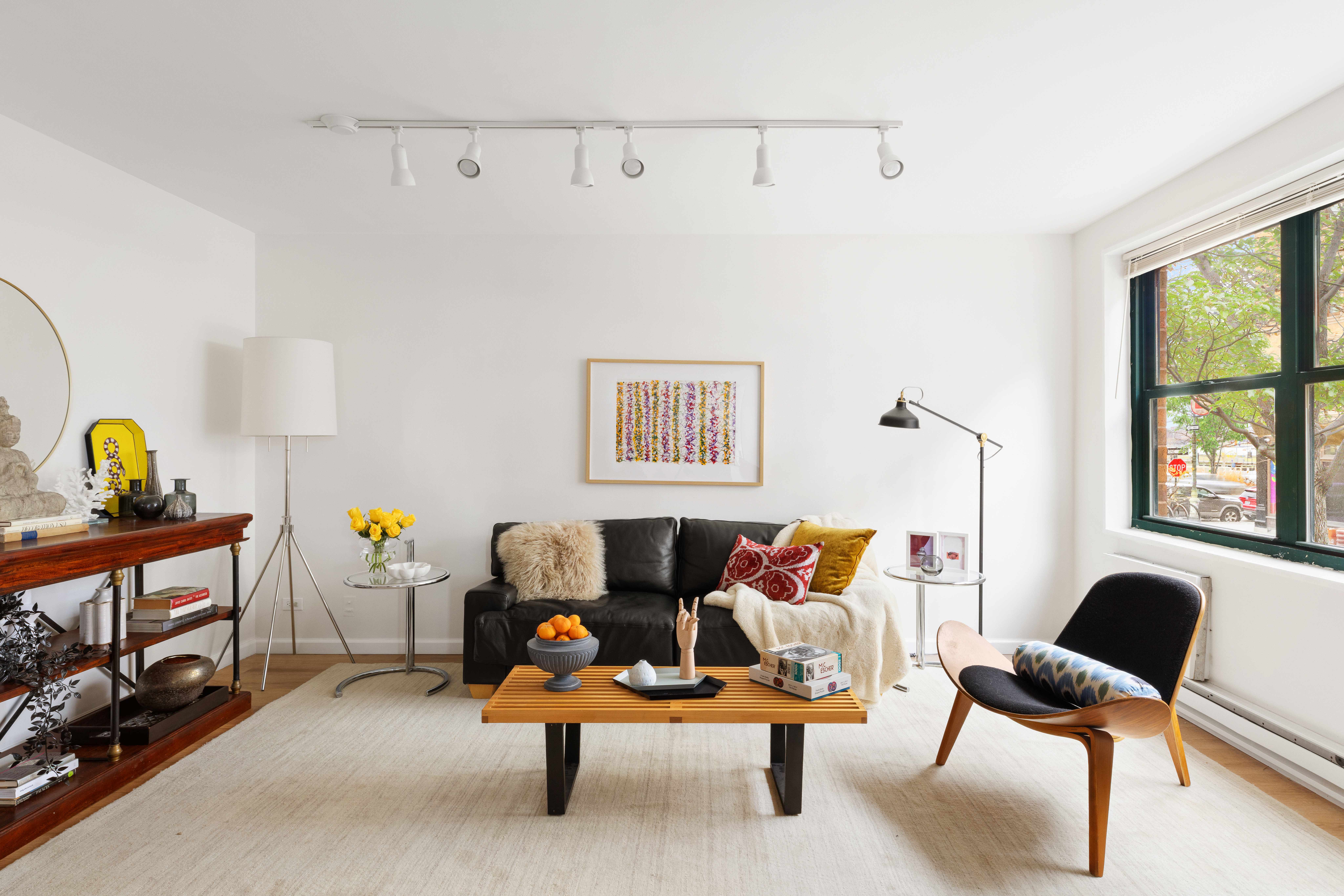 141 Barrow Street, Unit 1B Manhattan, NY 10014 - Photo 3 of 10 a living room with furniture and a window