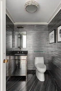 a view of a livingroom with furniture and a window