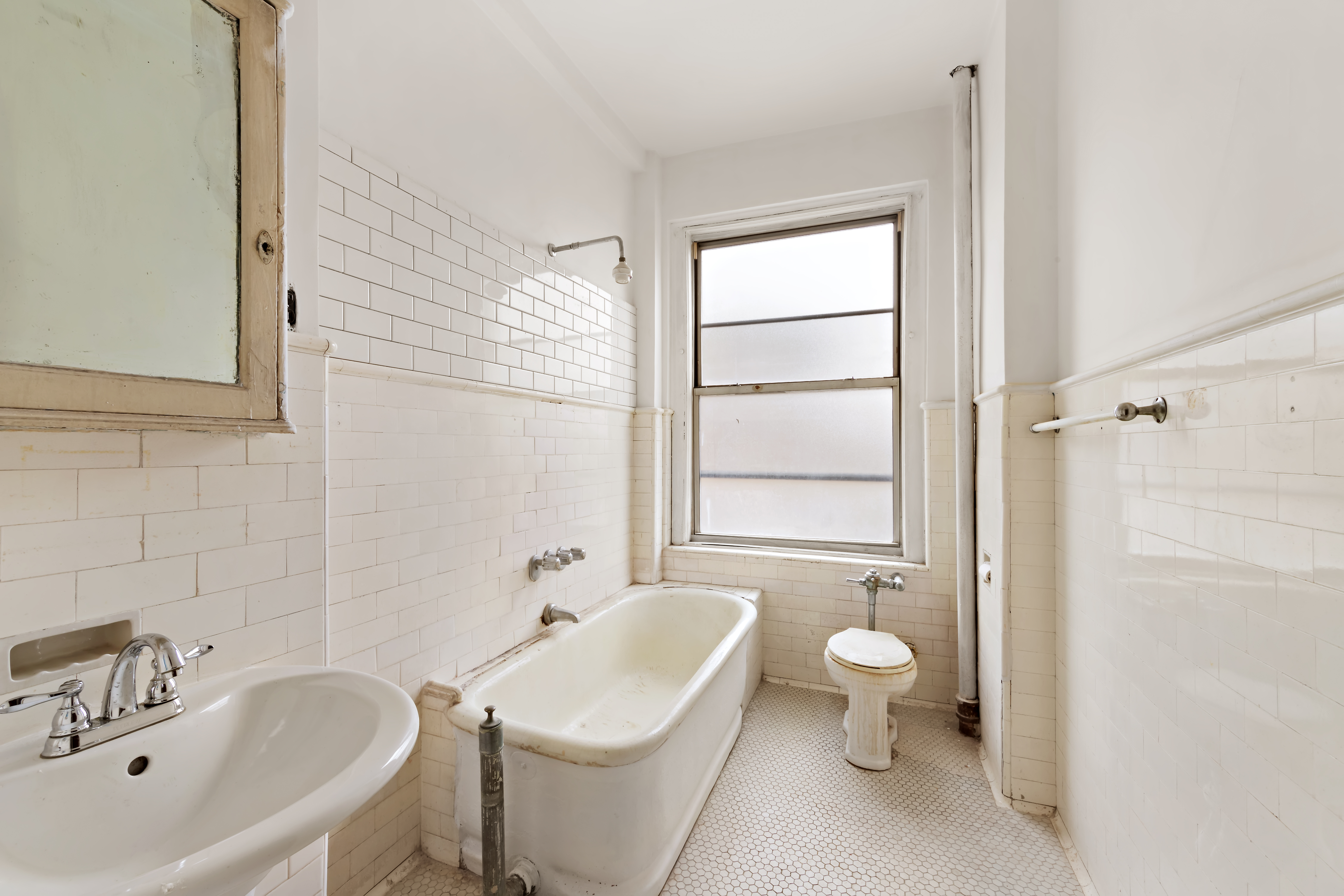 800 Riverside Drive, Unit 6E Manhattan, NY 10032 - Photo 19 of 30 a bathroom with a sink toilet and shower