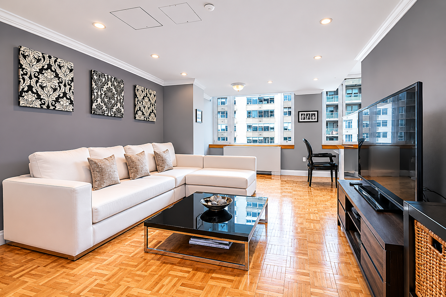 404 East 76th Street, Unit 6B Manhattan, NY 10021 - Photo 1 of 7 a living room with furniture and a flat screen tv