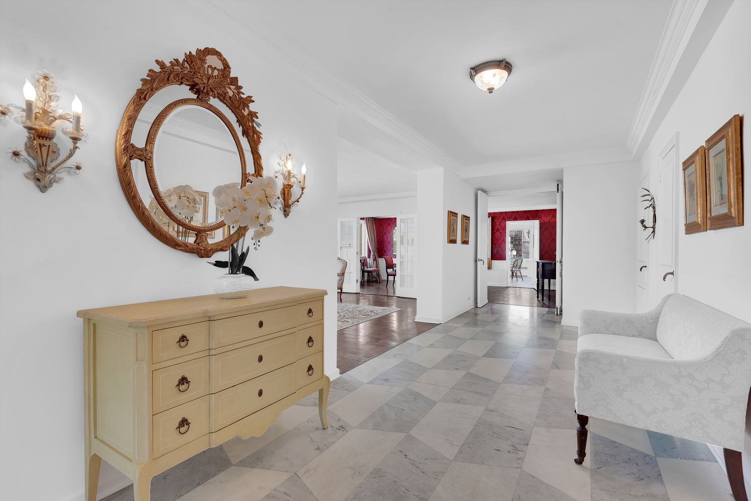 936 5th Avenue, Unit 14B Manhattan, NY 10021 - Photo 4 of 15 a living room with furniture and a mirror