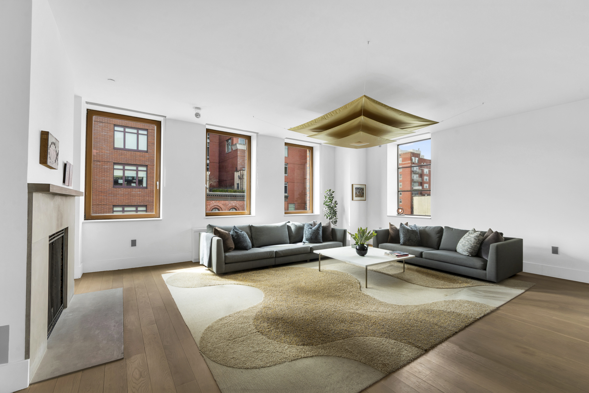 267 West 124th Street, Unit 6A Manhattan, NY 10027 - Photo 2 of 24 a living room with furniture and a large window