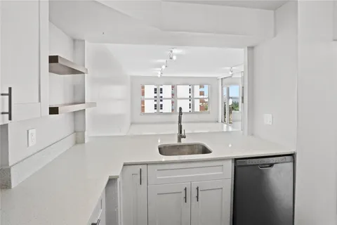a kitchen with a sink and a window