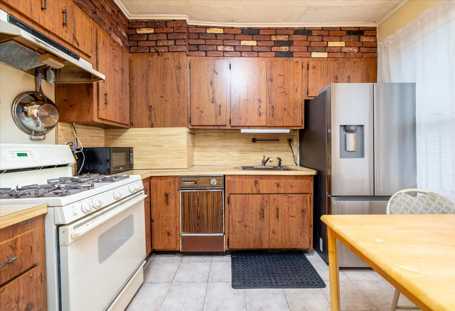 a kitchen with a white cabinets and white appliances