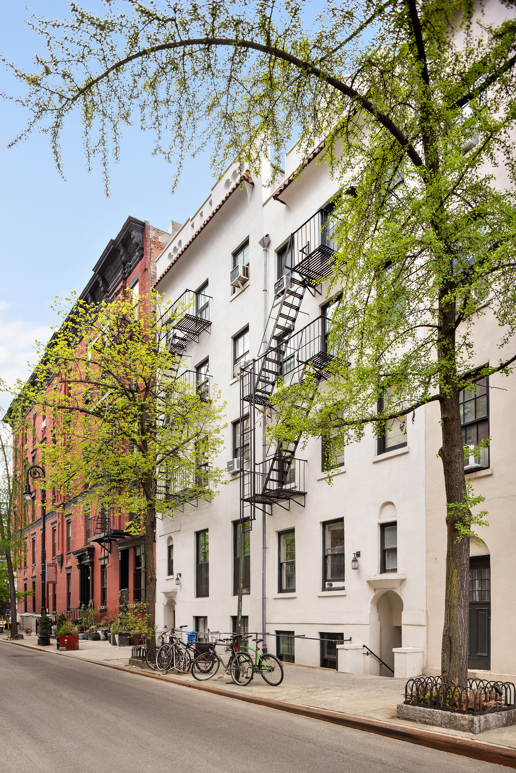 118 Perry Street, Unit J45 Manhattan, NY 10014 - Photo 5 of 6 front view of a building with a street