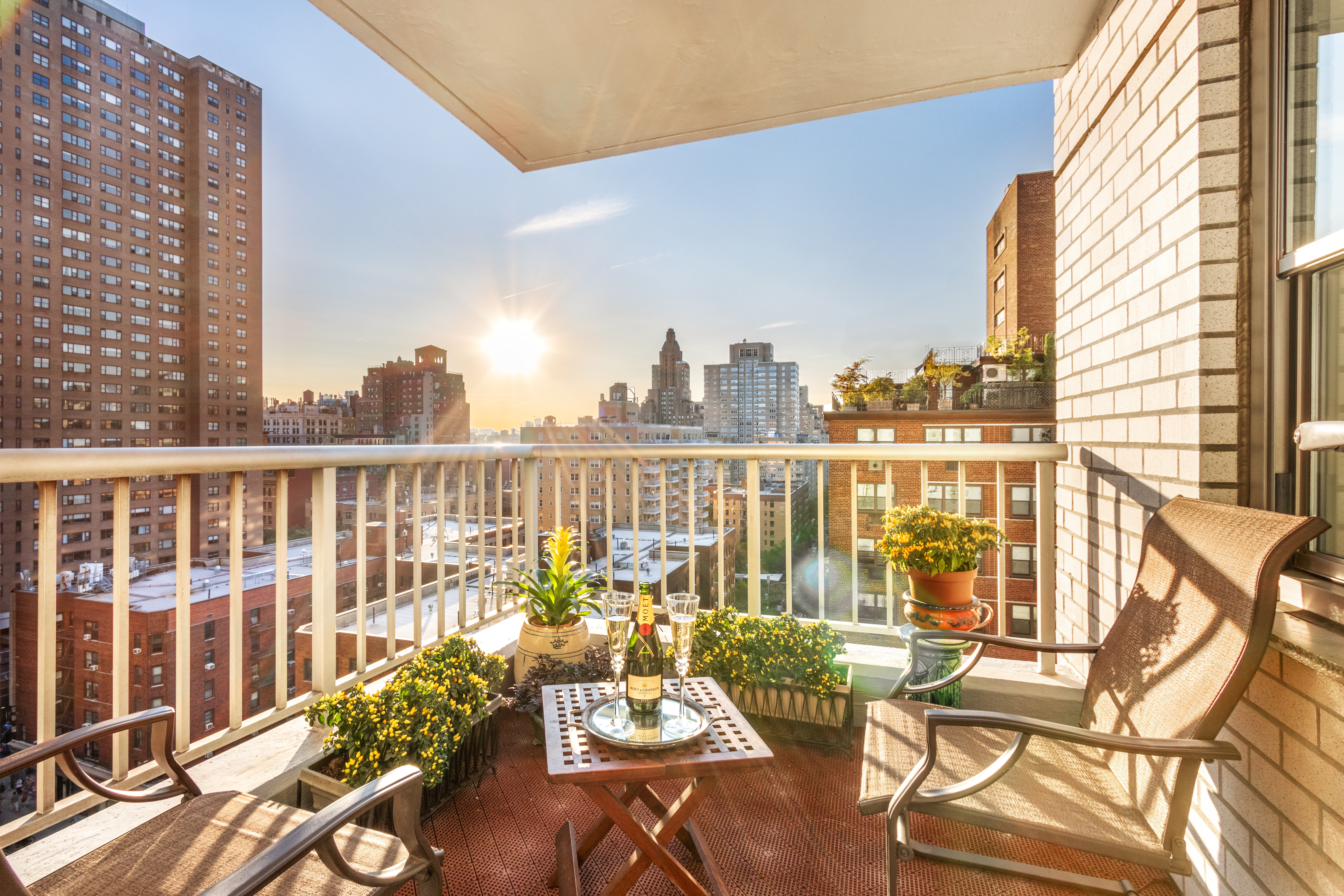 70 East 10th Street, Unit 14M Manhattan, NY 10003 - Photo 2 of 22 a view of a balcony with chairs and wooden floor