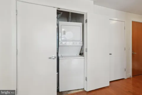 a view of walk in closet with empty room