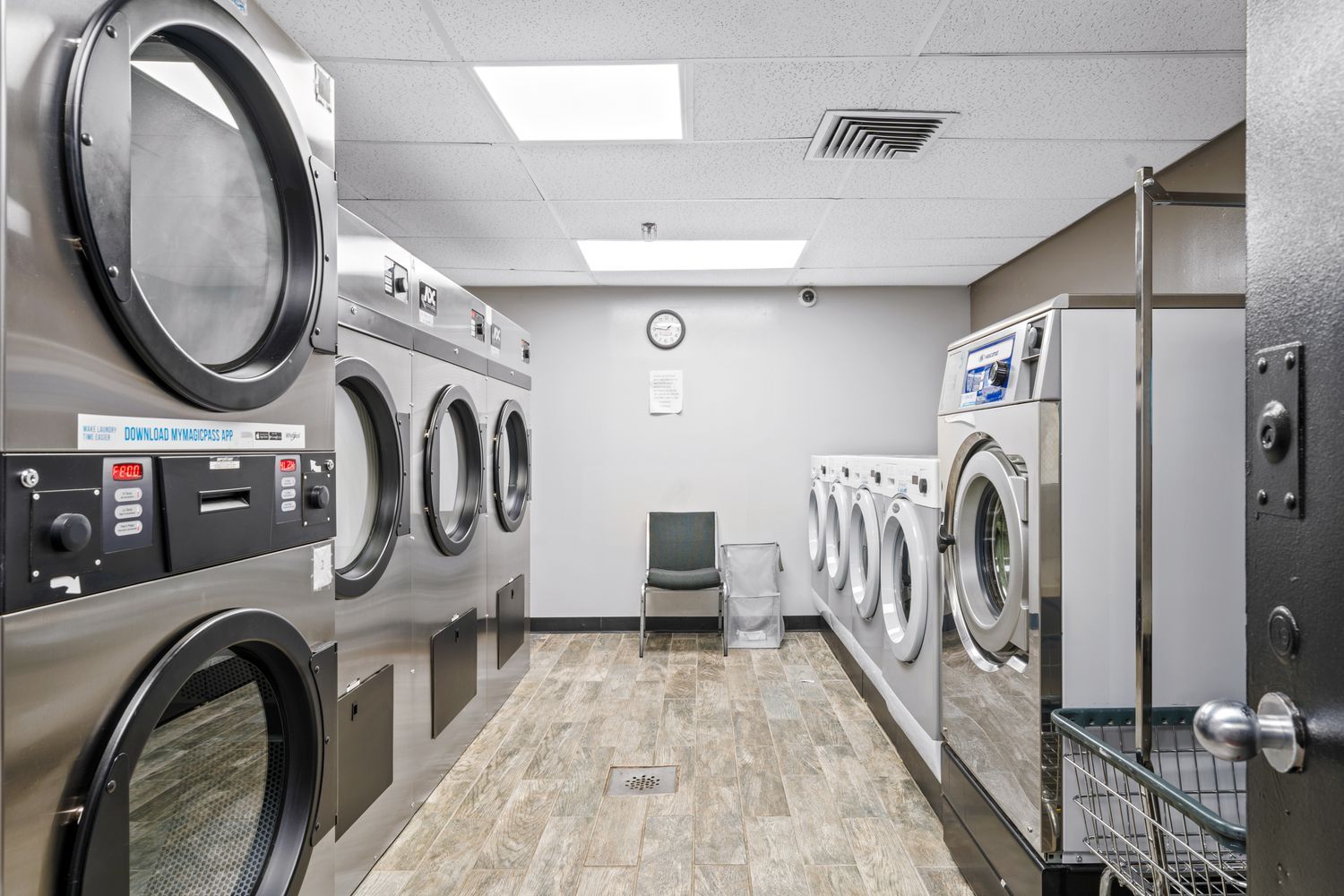 201 West 74th Street, Unit 16A Manhattan, NY 10023 - Photo 7 of 13 a utility room with multiple dryer and washer