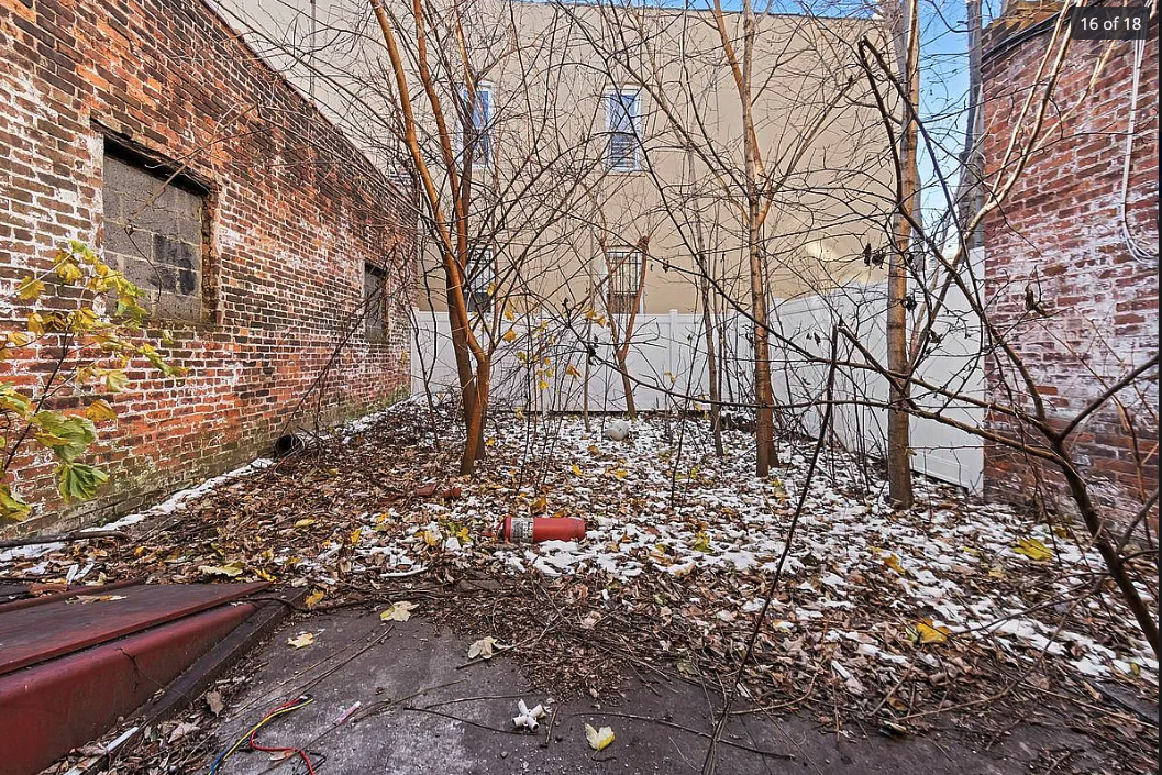 426 Rogers Avenue Brooklyn, NY 11225 - Photo 4 of 9 a backyard of a house with lots of green space