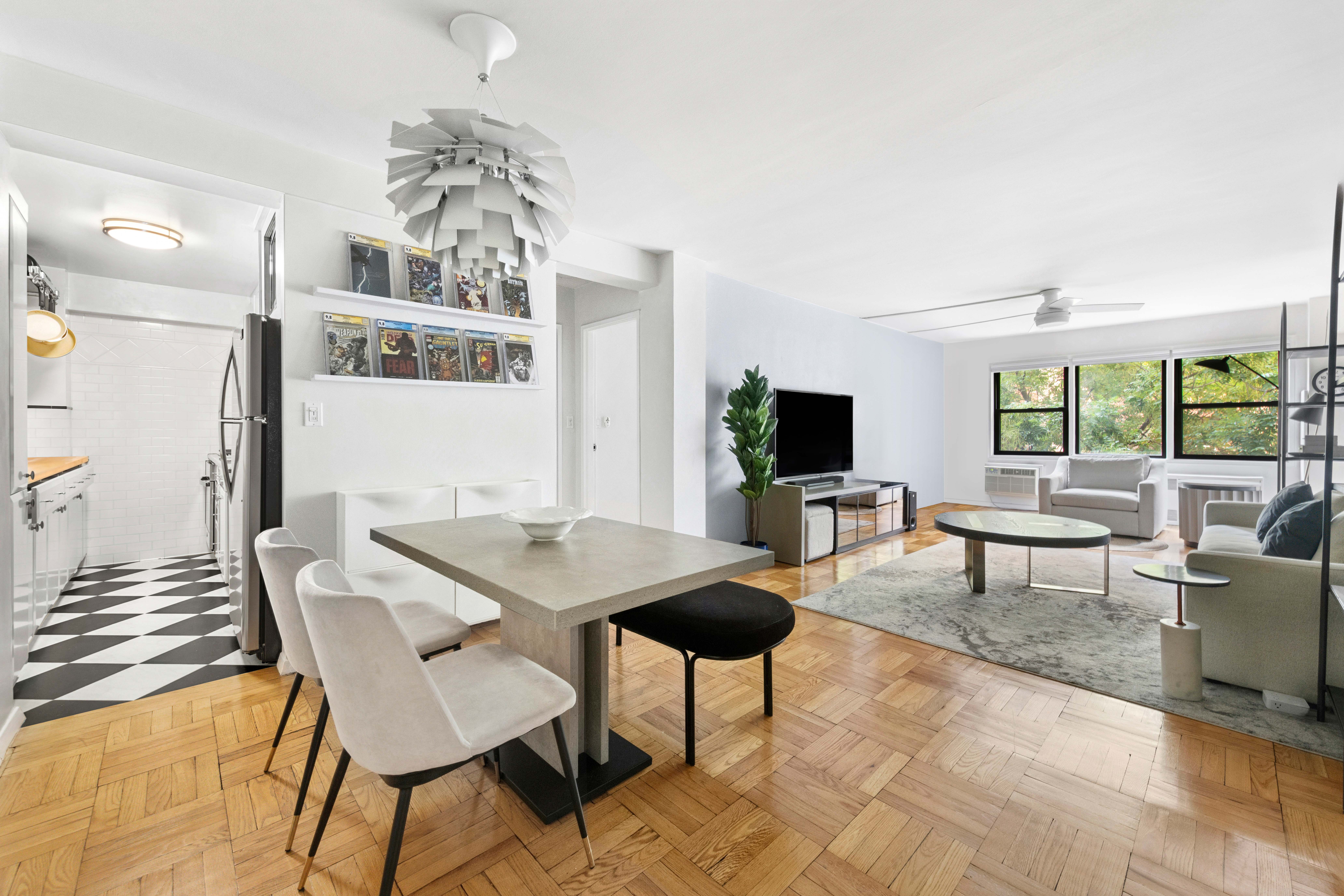 205 East 77th Street, Unit 4B Manhattan, NY 10075 - Photo 3 of 10 a view of a livingroom with furniture and a table