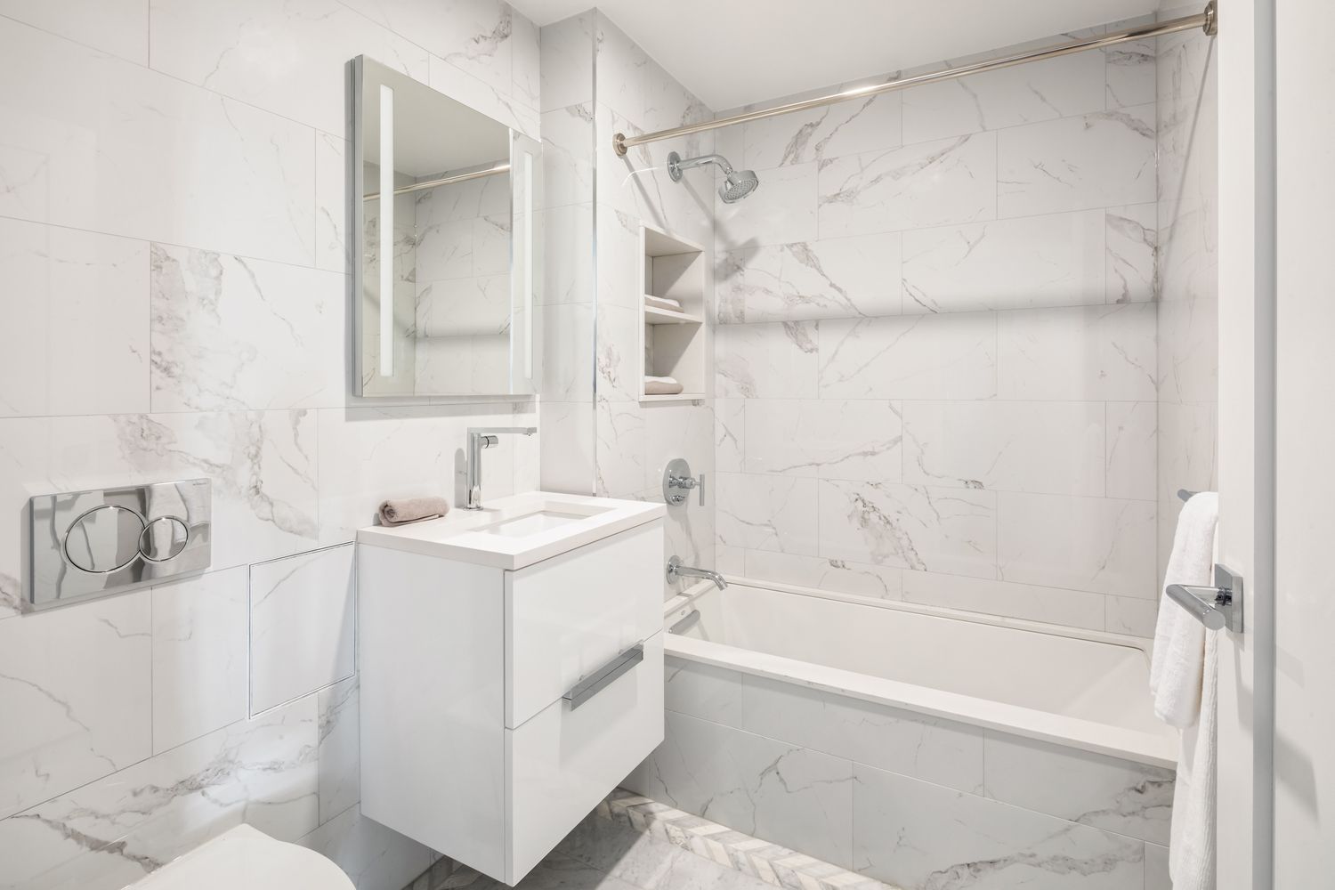 a bathroom with a sink a mirror and a bathtub