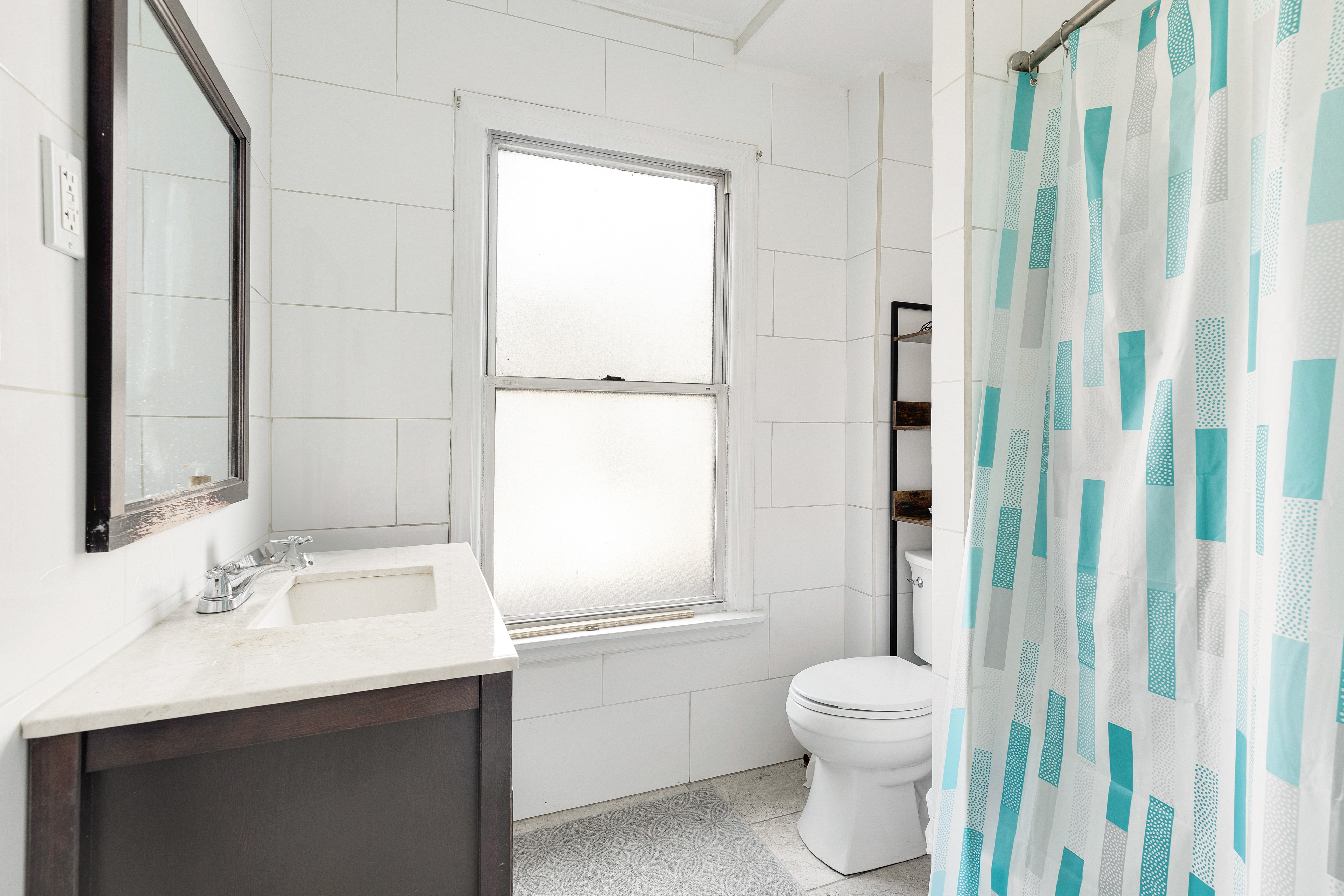 35-47 30th Street Queens, NY 11106 - Photo 6 of 14 a bathroom with a sink a toilet and shower