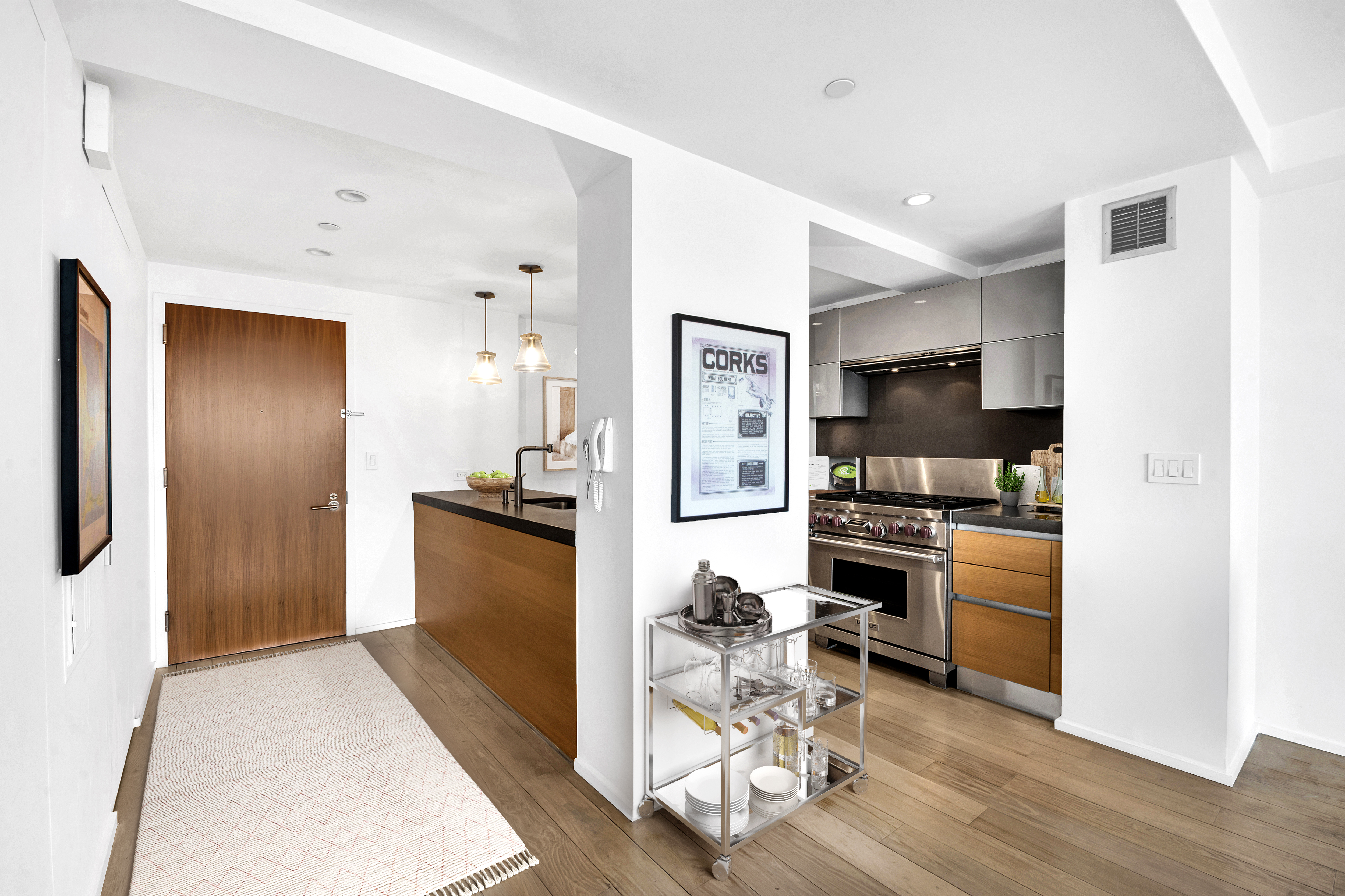 2280 Frederick Douglass Boulevard, Unit 10B Manhattan, NY 10027 - Photo 7 of 15 a kitchen with a refrigerator and a stove top oven