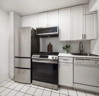 a kitchen with appliances a sink and cabinets