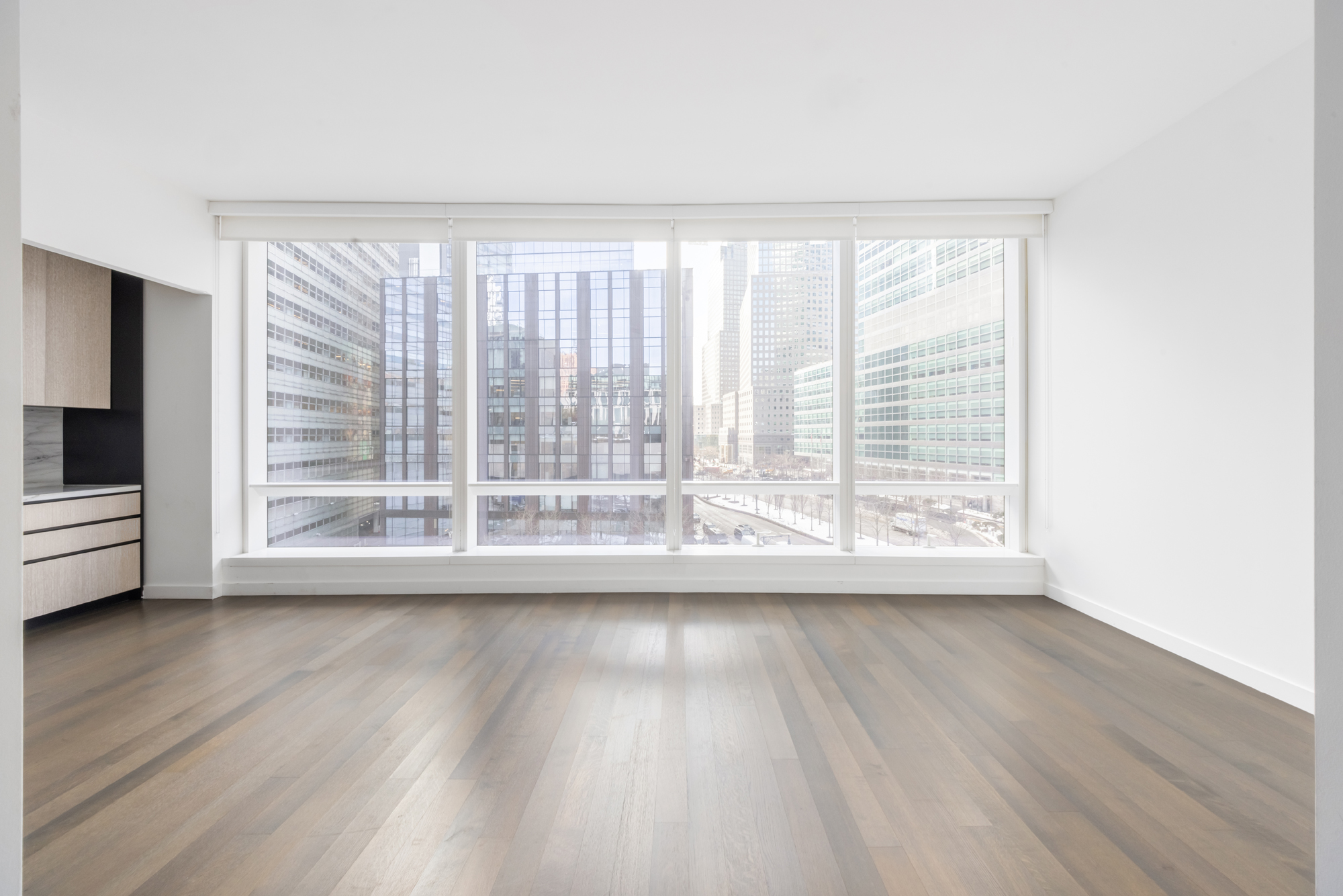 111 Murray Street, Unit 7D Manhattan, NY 10007 - Photo 3 of 17 a view of wooden floor and windows in a room