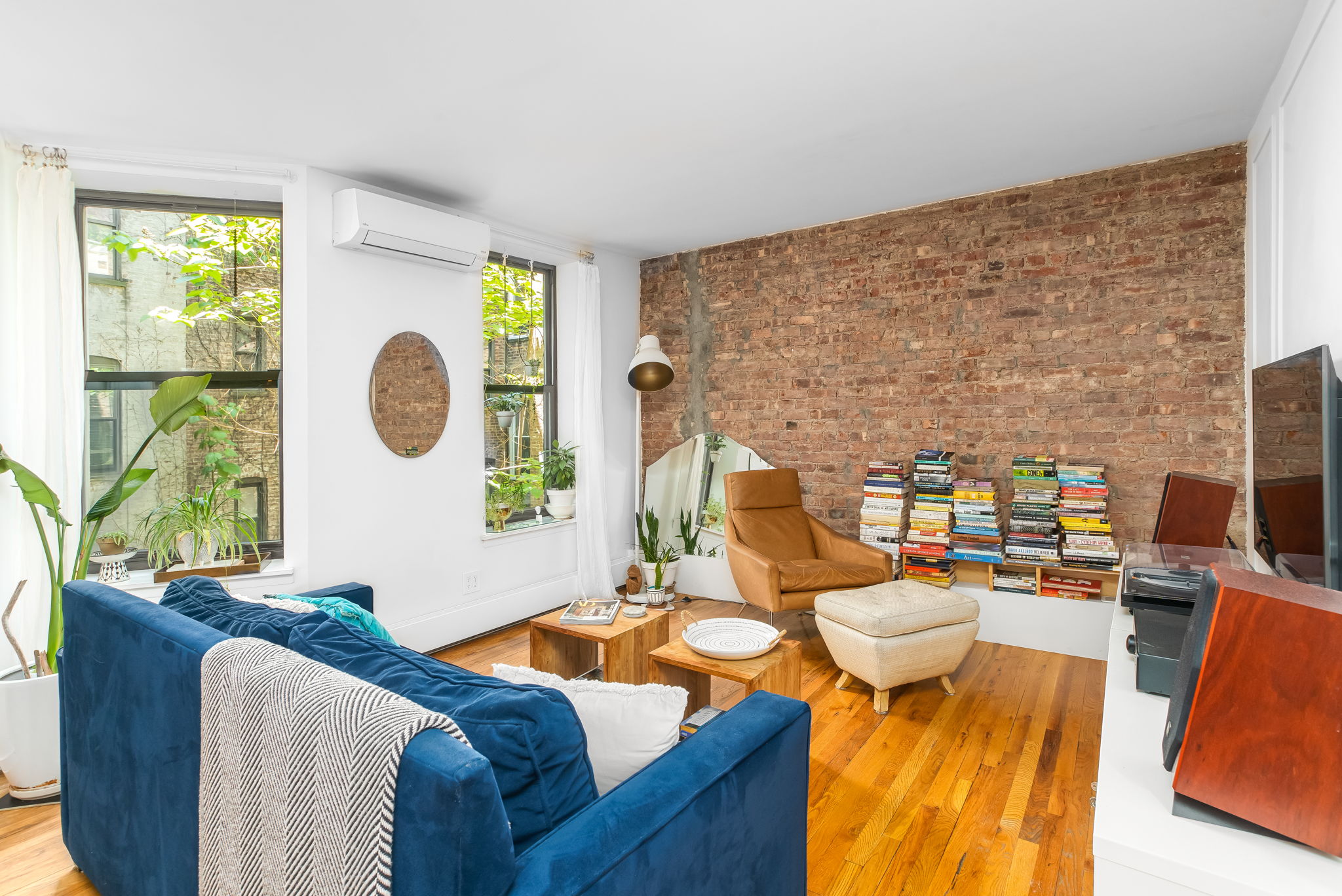 427 St Johns Place, Unit 2B Brooklyn, NY 11238 - Photo 4 of 11 a living room with furniture and a large window