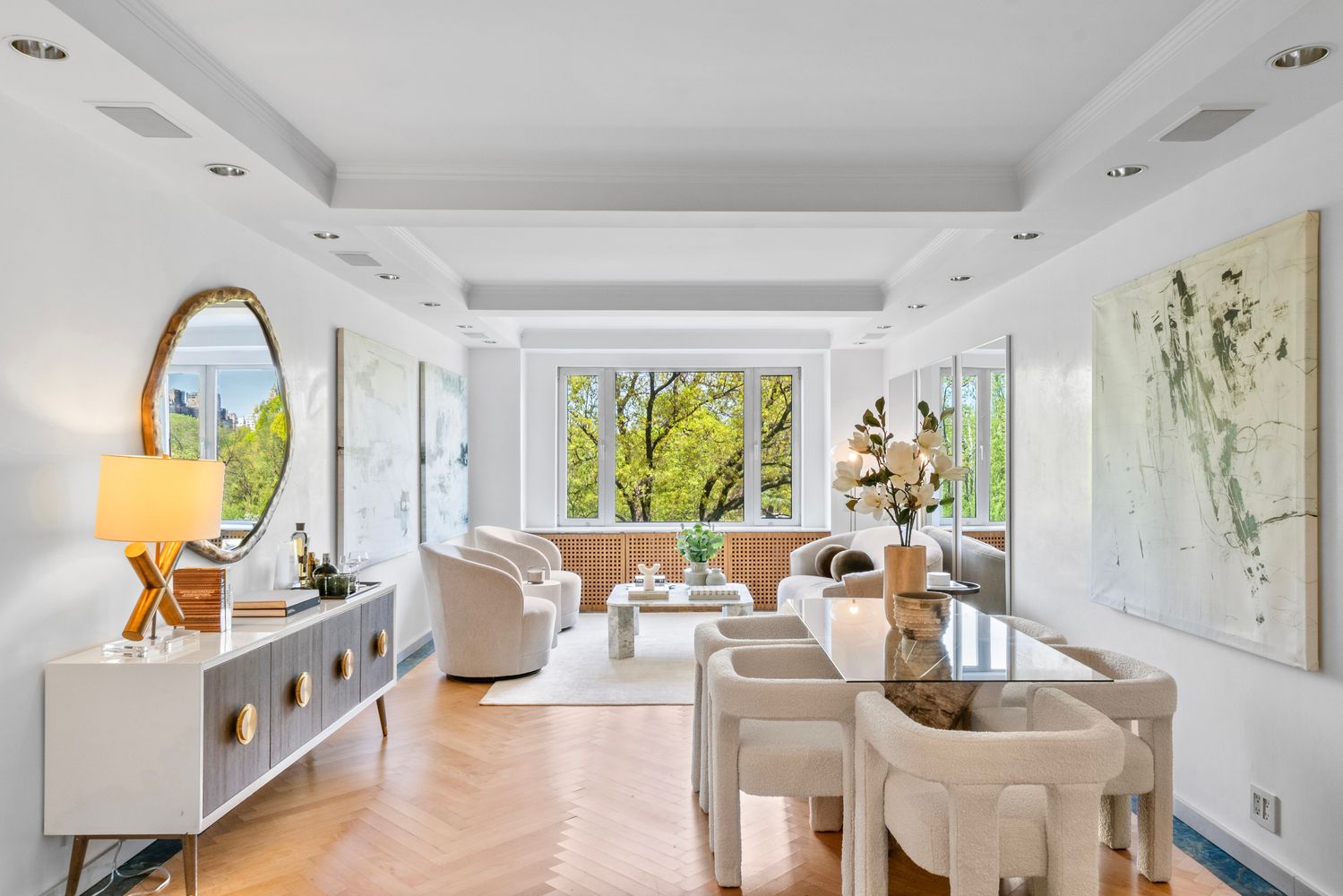 a living room with fireplace furniture and a large window