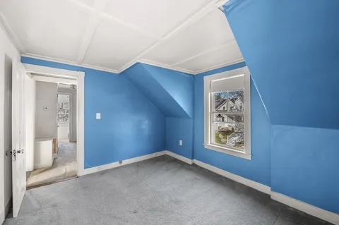 a balcony with table and chairs