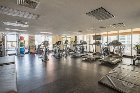 a room with lots of gym equipment