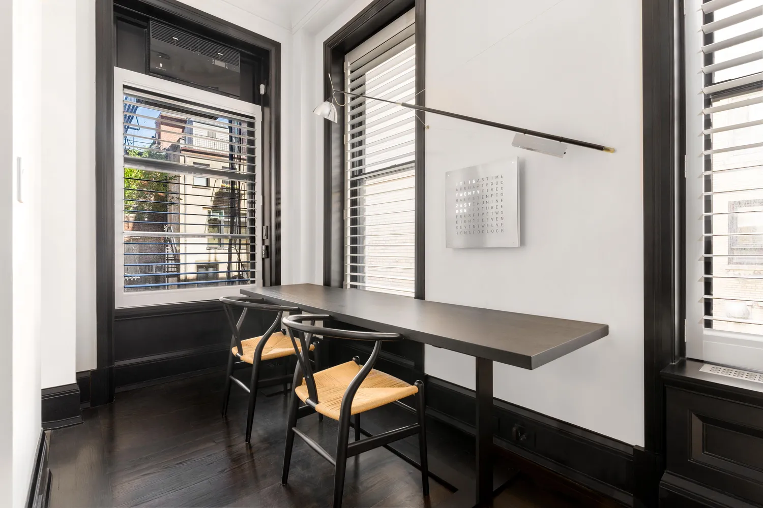 a dining room with table and chairs