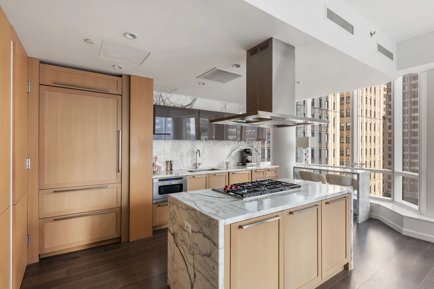 a kitchen with a refrigerator a stove a sink and a window