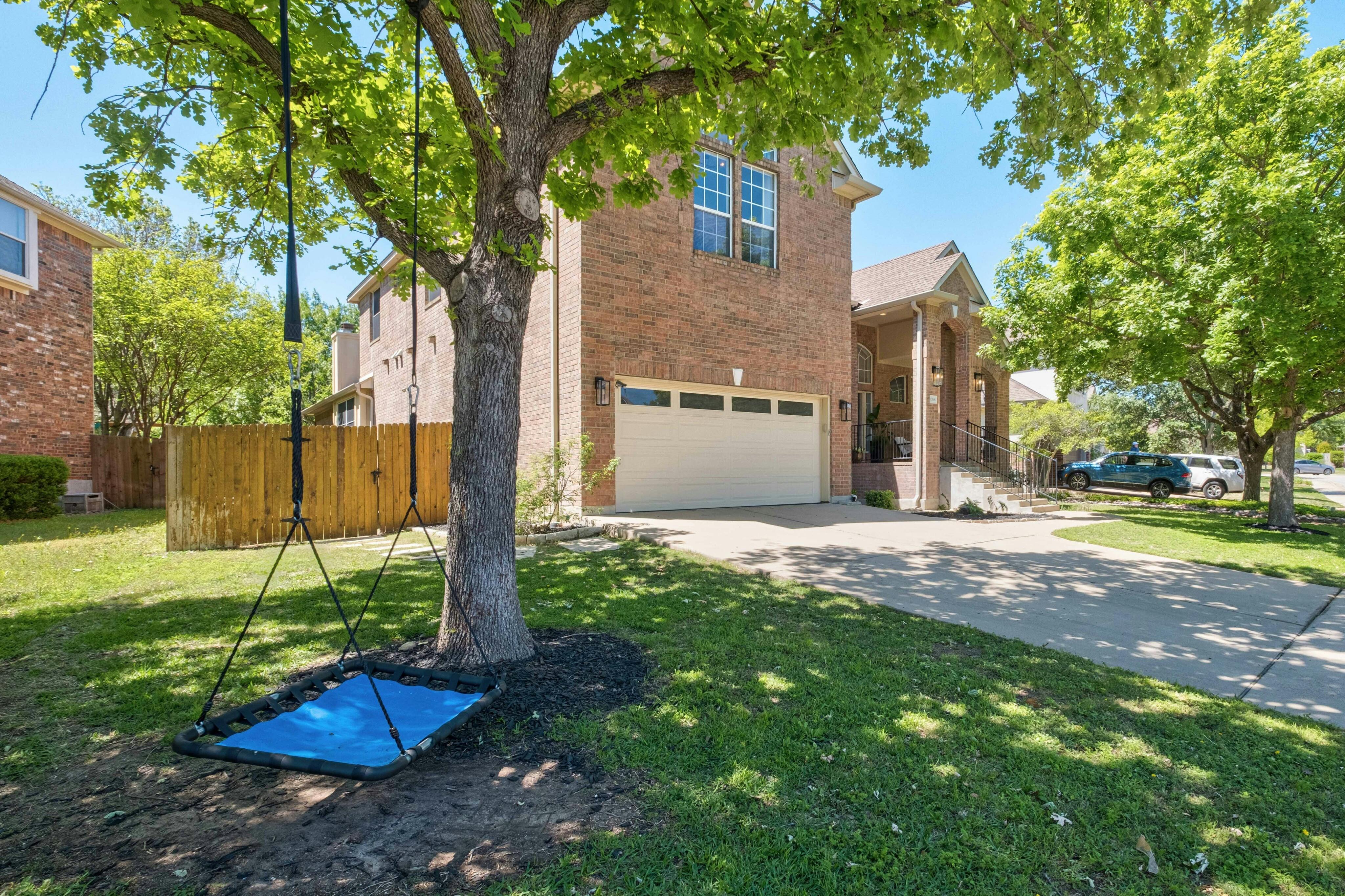 10608 Pointe View Drive Austin, TX 78738 - Photo 4 of 46 a view of a house with backyard and a tree