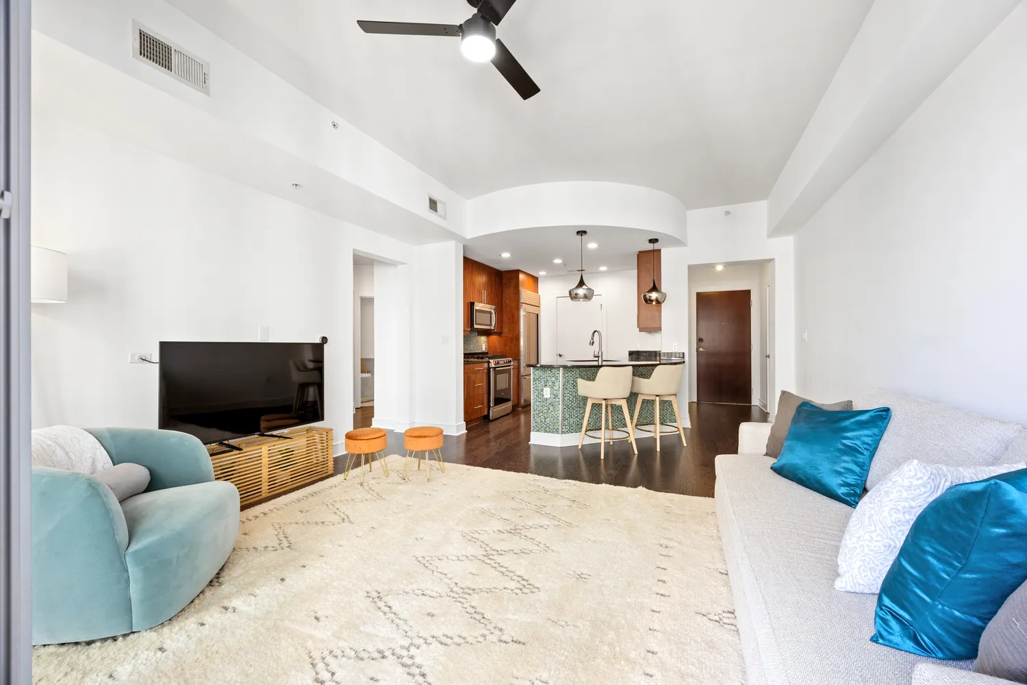 a bedroom with furniture and a flat screen tv