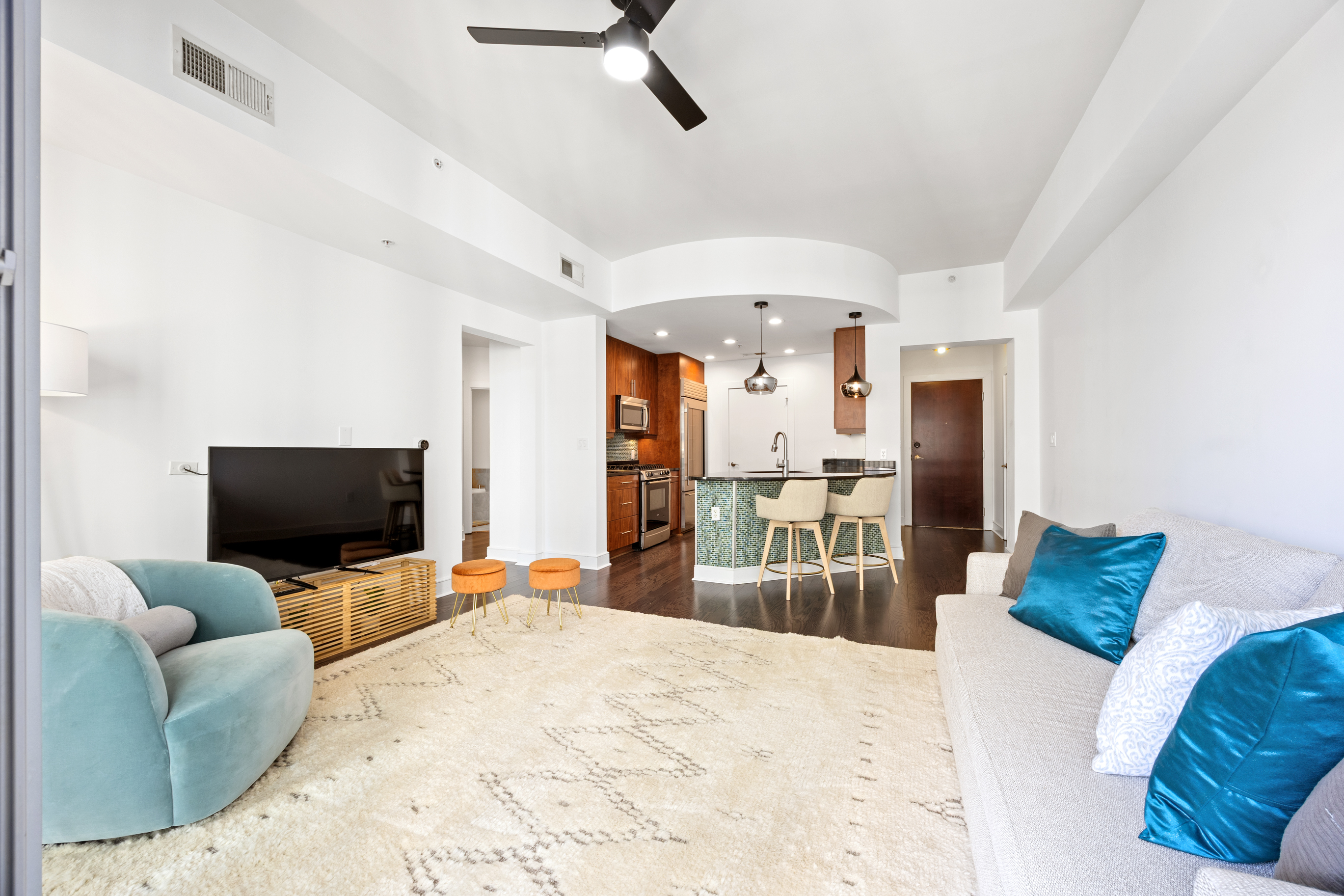 222 12th Street Northeast Atlanta, GA 30309 - Photo 8 of 56 a bedroom with furniture and a flat screen tv