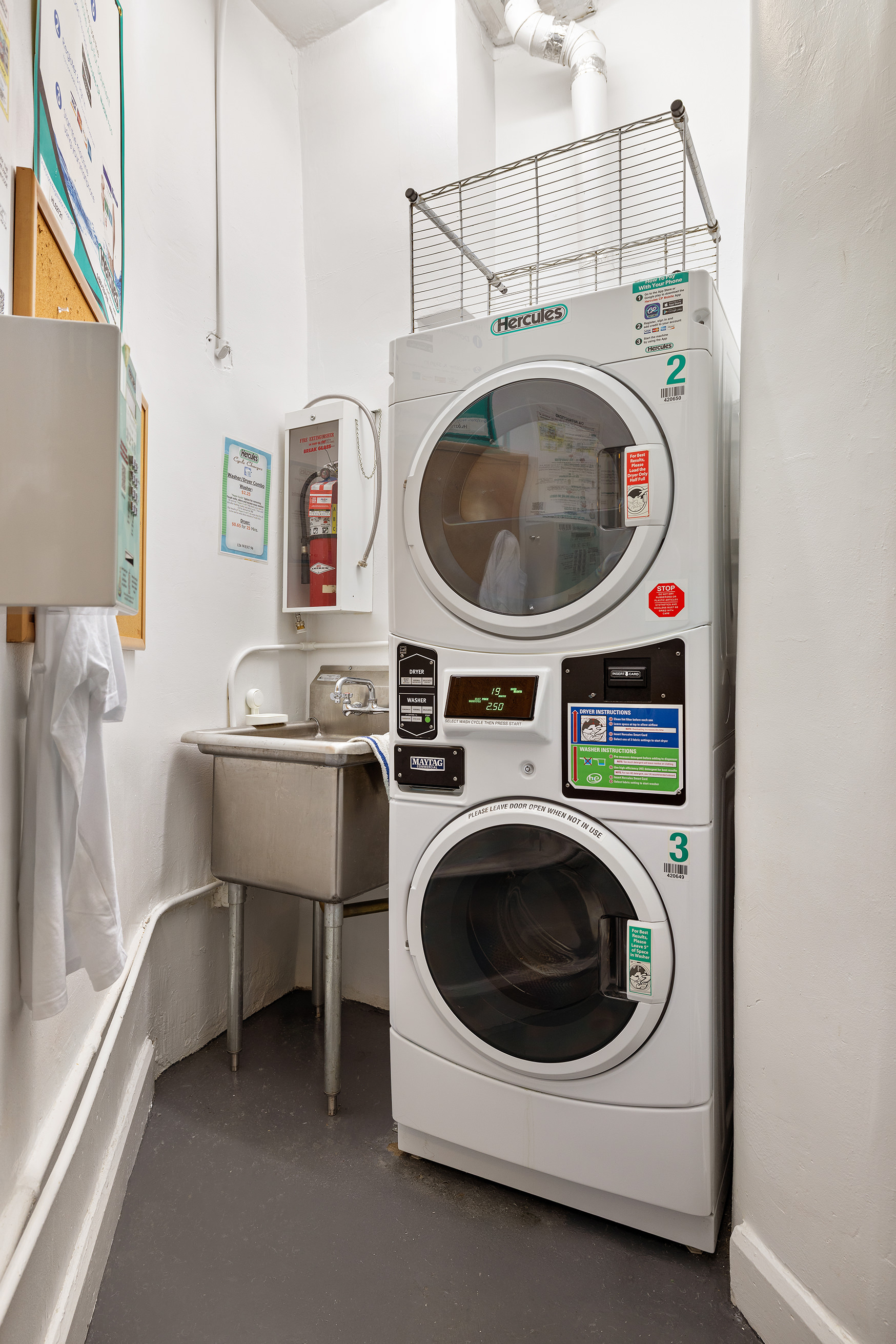 126 West 96th Street, Unit 3E Manhattan, NY 10025 - Photo 8 of 9 a utility room with dryer and washer